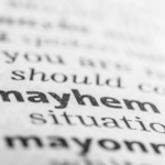 Close up of the definition of mayhem.