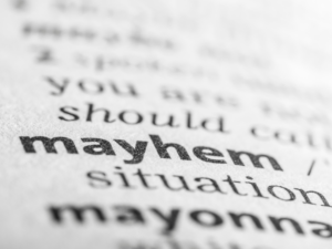 Close up of the definition of mayhem.